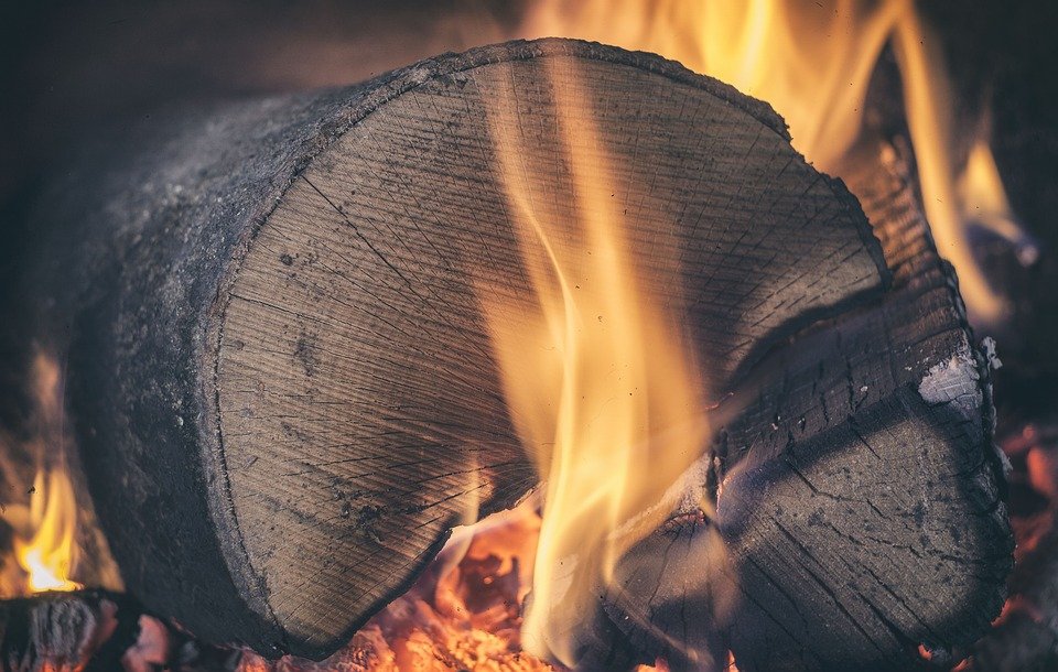 Wood that is not seasoned or has a lot of sap, instead of heating, produces a lot of smoke, so it stains more.